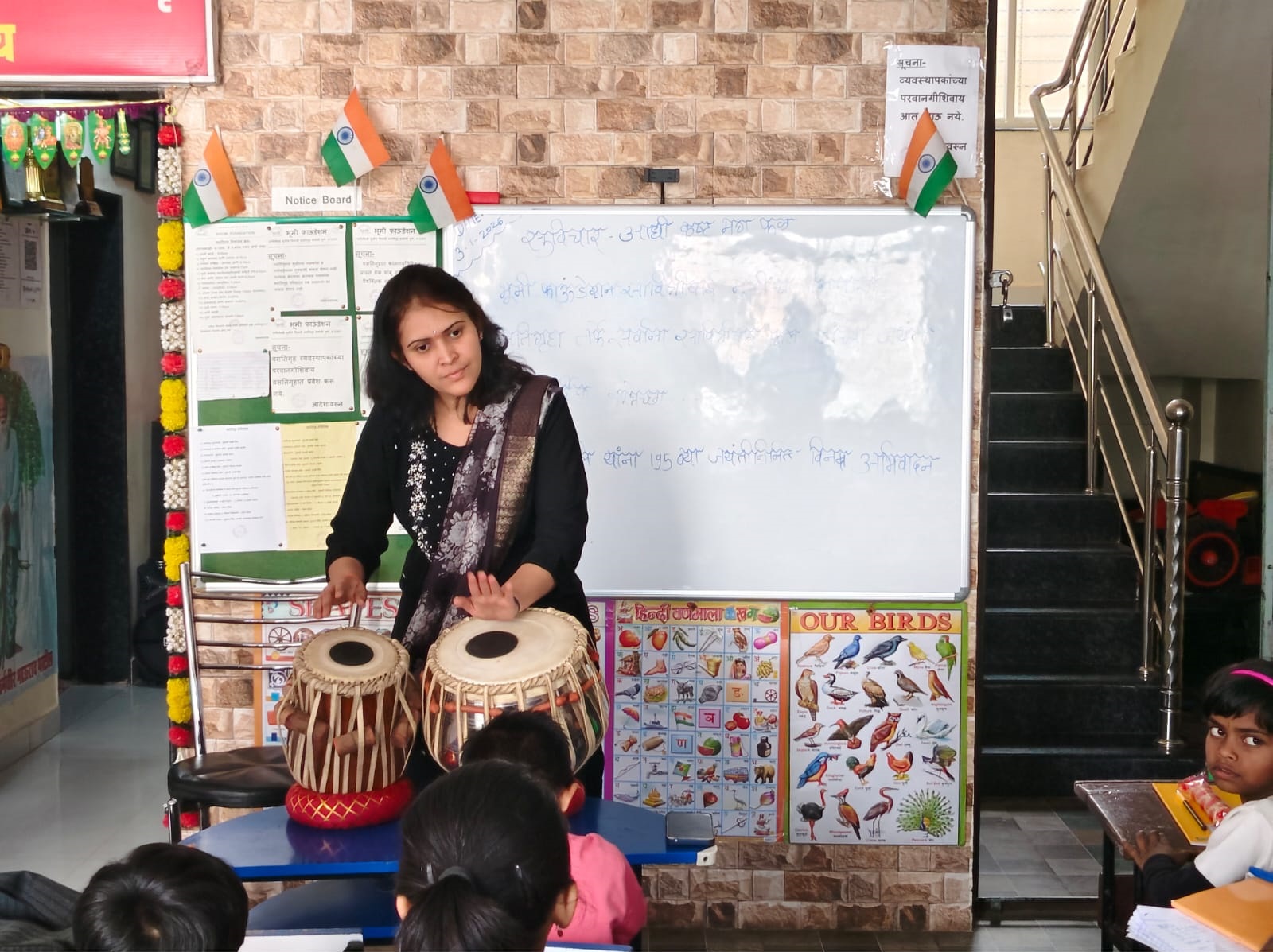 Providing musical instrument training to the daughters of farmers at the organization's residential project.
